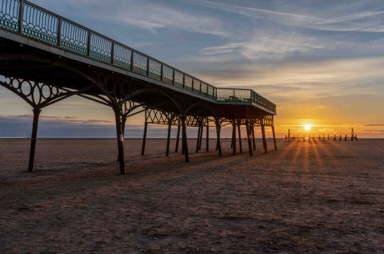 The winter sun sets behind Lytham St Annes Pier