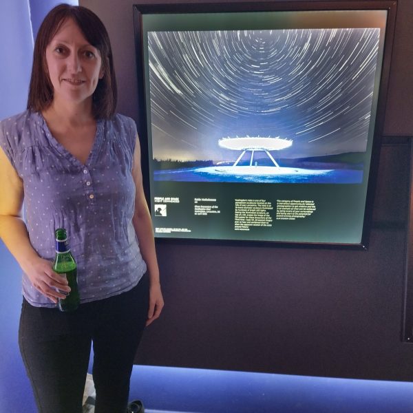 katie mcguinness stood with her award winning photograph Close Encounters of the Haslingden Kind